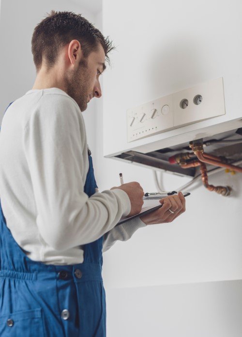 Gas Safe engineer servicing a boiler
