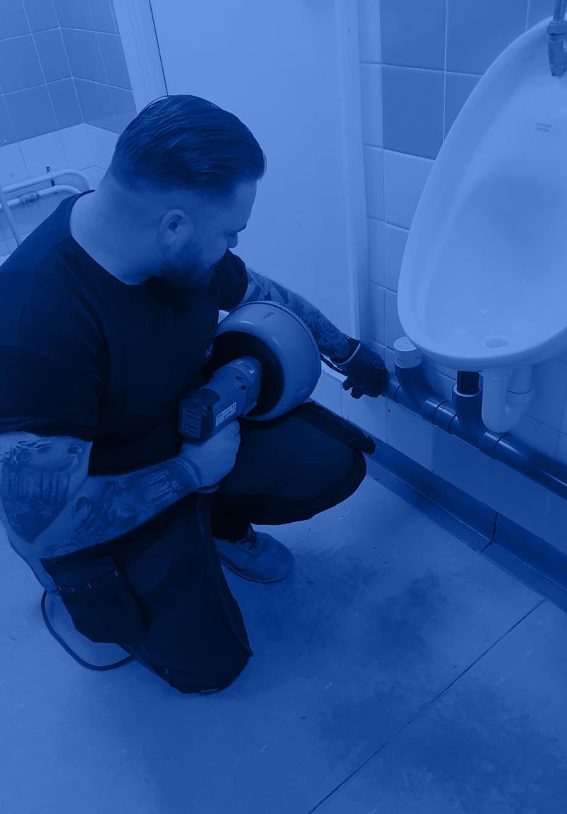 Aquevo engineer servicing a urinal