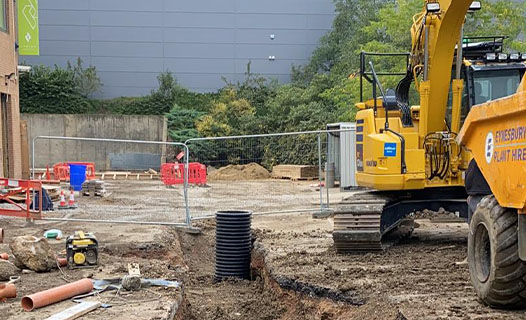Excavator on a drainage installation site